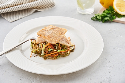 Hake fillet with crispy crust served on sea kale pillows
