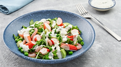 Salad with crab sticks, shrimp and peas