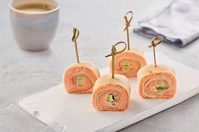 Pancake rolls with caviar cream, cucumber and avocado